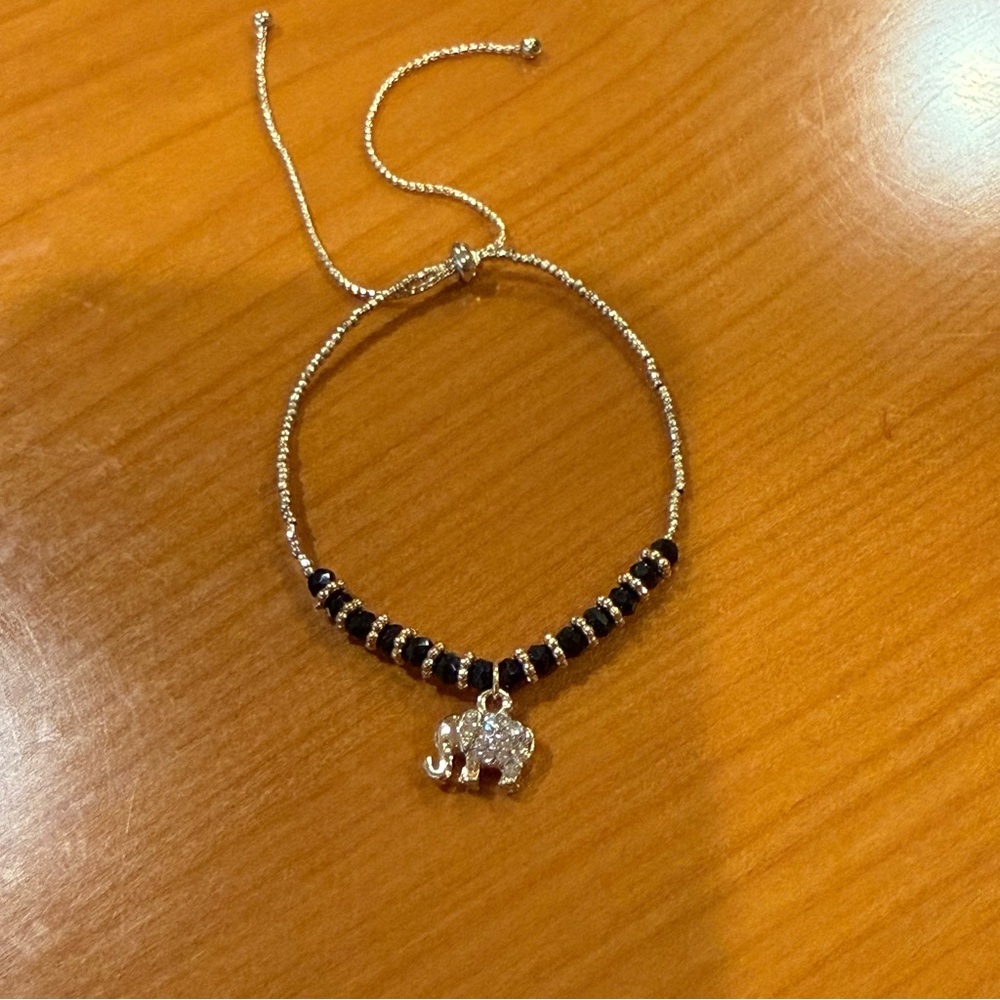 Elegant Gold and Black Beaded Elephant Charm Bracelet